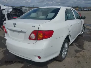 2009 Toyota Corolla with VIN 1NXBU40E59Z023792, listed as a IAAI auction lot 41743473 with 128,454 mi miles. Bid and sale history available at carsss.com. Image 4.