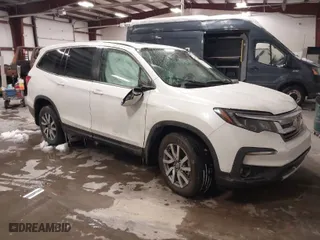 2021 Honda Pilot EX-L with VIN 5FNYF5H57MB040081, listed as a IAAI auction lot 41292215 with 72,639 mi miles. Bid and sale history available at carsss.com. Image 1.
