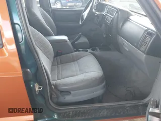 1997 Jeep Cherokee Sport with VIN 1J4FJ68SXVL517077, listed as a IAAI auction lot 42350553 with Not provided miles and . Bid and sale history available at DreamBid. Image 5.