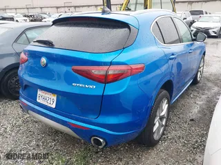 2021 Alfa Romeo Stelvio Ti with VIN ZASPAKBN0M7D18611, listed as a IAAI auction lot 41104626 with 30,188 mi miles. Bid and sale history available at carsss.com. Image 4.