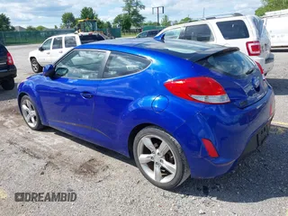2012 Hyundai Veloster w/Gray Int z VIN KMHTC6AD3CU074501, wystawiony jako IAAI lot #42289456 z przebiegiem 94 303 mil mil oraz . Historia ofert i sprzedaży dostępna na DreamBid. Obrazek 3.