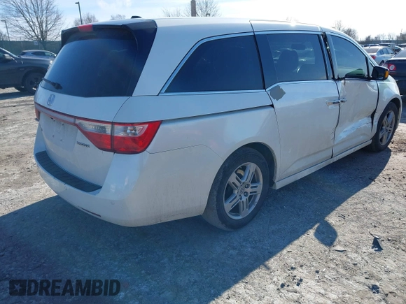 2012 Honda Odyssey Touring with VIN 5FNRL5H96CB010696, listed as a IAAI auction lot 41605868 with 109,411 mi miles and . Bid and sale history available at carsss.com. Image 4.