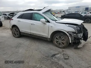 2021 Cadillac XT5 FWD Premium Luxury z VIN 1GYKNCR41MZ154357, wystawiony jako Copart lot #86819564 z przebiegiem Nie podano mil oraz Nie do naprawy • Non repairable. Historia ofert i sprzedaży dostępna na DreamBid. Obrazek 4.
