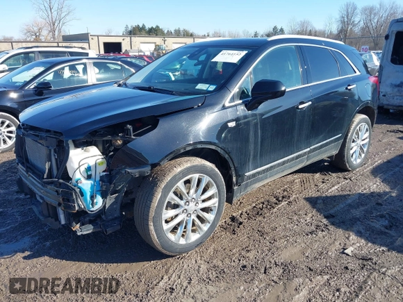 2019 Cadillac XT5 Premium Luxury AWD z VIN 1GYKNFRS1KZ250468, wystawiony jako IAAI lot #41764152 z przebiegiem 107 918 mil mil oraz . Historia ofert i sprzedaży dostępna na DreamBid. Obrazek 17.