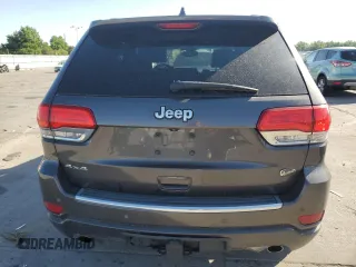 2017 Jeep Grand Cherokee Overland with VIN 1C4RJFCG9HC601806, listed as a Copart auction lot 61786275 with 122,898 mi miles and Salvage title. Bid and sale history available at DreamBid. Image 6.
