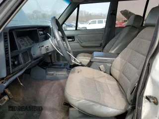 1994 Jeep Cherokee Sport with VIN 1J4FT68S0RL234669, listed as a Copart auction lot 44044555 with 282,179 mi miles and Salvage title. Bid and sale history available at DreamBid. Image 7.