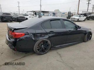 2020 BMW M5 z VIN WBSJF0C02LCE10800, wystawiony jako Copart lot #60674545 z przebiegiem Nie podano mil oraz Szkoda całkowita • Salvage title. Historia ofert i sprzedaży dostępna na DreamBid. Obrazek 3.