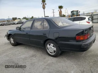 1995 Toyota Camry LE with VIN JT2GK12E2S0079545, listed as a Copart auction lot 84058164 with 150,539 mi miles and Salvage Title. Bid and sale history available at carsss.com. Image 2.