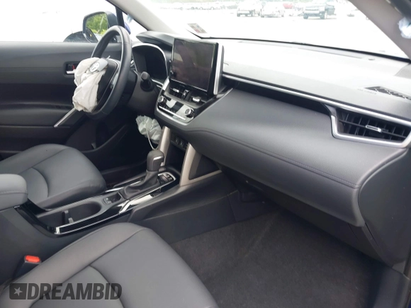 2023 Toyota Corolla Cross XLE with VIN 7MUEAAAG7PV065106, listed as a IAAI auction lot 42168195 with 6,519 mi miles and . Bid and sale history available at DreamBid. Image 5.