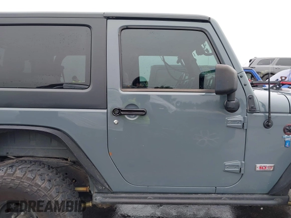 2013 Jeep Wrangler Rubicon 10th Anniversary with VIN 1C4BJWCG2DL651815, listed as a IAAI auction lot 41643919 with 98,297 mi miles and . Bid and sale history available at DreamBid. Image 13.