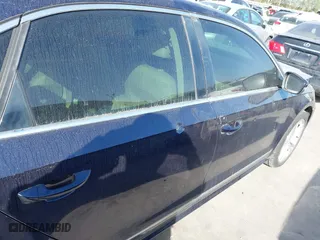 2013 Volkswagen Passat TDI SEL Premium with VIN 1VWCN7A33DC125396, listed as a IAAI auction lot 41862605 with 123,542 mi miles. Bid and sale history available at carsss.com. Image 16.