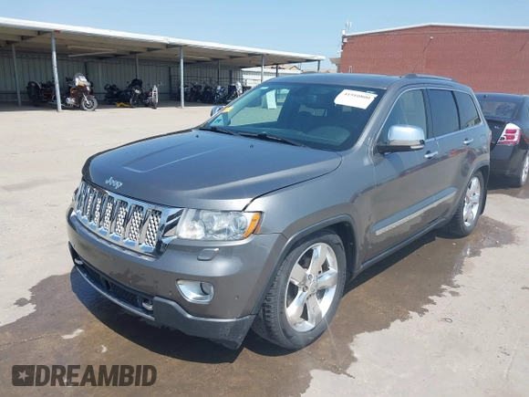 2013 Jeep Grand Cherokee Overland with VIN 1C4RJFCG2DC611877, listed as a IAAI auction lot 41910800 with 151,457 mi miles. Bid and sale history available at carsss.com. Image 18.