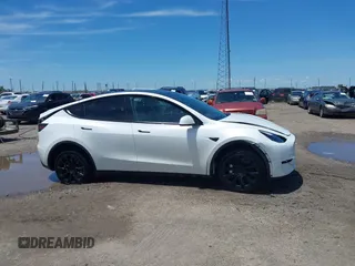 2023 Tesla Model Y Long Range z VIN 7SAYGDEE9PF753051, wystawiony jako IAAI lot #39615839 z przebiegiem Nie podano mil oraz . Historia ofert i sprzedaży dostępna na DreamBid. Obrazek 12.