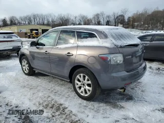 2009 Mazda CX-7 Grand Touring z VIN JM3ER29L990221136, wystawiony jako Copart lot #45233915 z przebiegiem 156 676 mil mil oraz Czysty tytuł • Clean title. Historia ofert i sprzedaży dostępna na DreamBid. Obrazek 2.