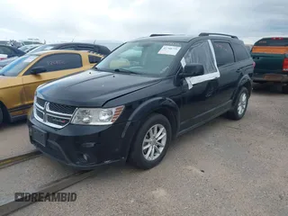 2016 Dodge Journey SXT with VIN 3C4PDDBG3GT215910, listed as a IAAI auction lot 41798779 with 165,505 mi miles. Bid and sale history available at carsss.com. Image 2.