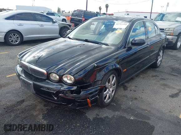 2004 Jaguar X-Type with VIN SAJEA51C44WD56659, listed as a IAAI auction lot 41712395 with Not Provided miles and . Bid and sale history available at DreamBid. Image 2.