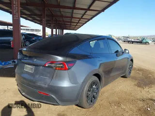 2022 Tesla Model Y Long Range with VIN 7SAYGDEE2NA017434, listed as a IAAI auction lot 41842025 with 35,164 mi miles and . Bid and sale history available at DreamBid. Image 4.