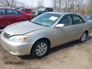 2004 Toyota Camry LE with VIN 4T1BF30K94U587836, listed as a IAAI auction lot 41714277 with 211,893 mi miles and . Bid and sale history available at carsss.com. Image 2.