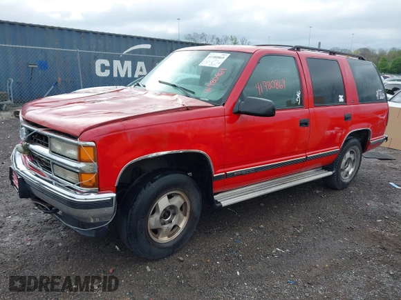 1998 GMC Yukon with VIN 1GKEK13R0WJ703105, listed as a IAAI auction lot 41980869 with 302,546 mi miles. Bid and sale history available at carsss.com. Image 2.