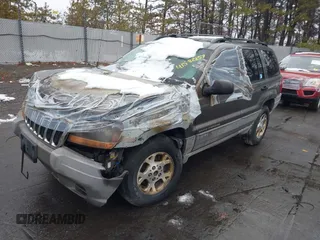 2000 Jeep Grand Cherokee Laredo with VIN 1J4GW48S1YC170303, listed as a IAAI auction lot 41582257 with 191,062 mi miles and . Bid and sale history available at DreamBid. Image 2.