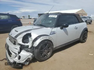 2015 MINI Convertible S with VIN WMWZP3C52FT298857, listed as a Copart auction lot 58149145 with 52,777 mi miles and Salvage title. Bid and sale history available at DreamBid. Image 1.