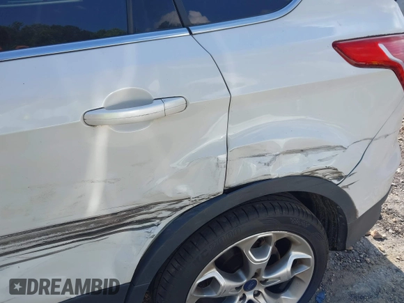 2015 Ford Escape Titanium with VIN 1FMCU9J90FUA05005, listed as a IAAI auction lot 42501764 with 121,993 mi miles and . Bid and sale history available at DreamBid. Image 6.