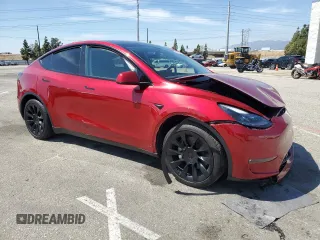 2024 Tesla Model Y Long Range with VIN 7SAYGAEE0RF016323, listed as a Copart auction lot 50253205 with 12,490 mi miles and Salvage title. Bid and sale history available at DreamBid. Image 4.