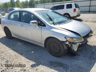 2010 Honda Civic LX with VIN 19XFA1F51AE016877, listed as a Copart auction lot 52275475 with 217,152 mi miles and Salvage Title. Bid and sale history available at DreamBid. Image 4.