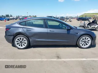 2022 Tesla Model 3 with VIN 5YJ3E1EA6NF144098, listed as a IAAI auction lot 41965360 with 75,597 mi miles. Bid and sale history available at carsss.com. Image 13.