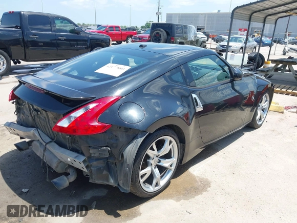 2012 Nissan 370Z z VIN JN1AZ4EH1CM564630, wystawiony jako IAAI lot #42177880 z przebiegiem 173 751 mil mil oraz . Historia ofert i sprzedaży dostępna na DreamBid. Obrazek 4.