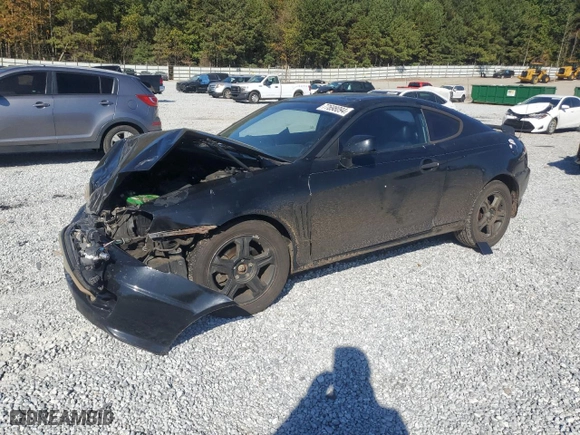2003 Hyundai Tiburon GT with VIN KMHHN65F33U072954, listed as a Copart auction lot 77698094 with 235,445 mi miles and Salvage Title. Bid and sale history available at carsss.com. Image 1.