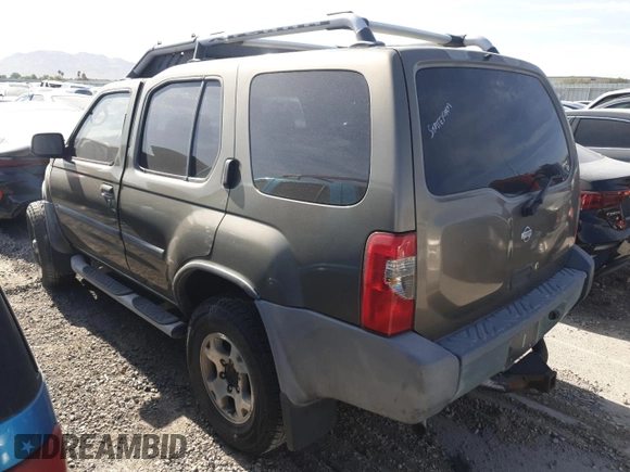 2001 Nissan Xterra XE with VIN 5N1ED28T91C541628, listed as a Copart auction lot 57712125 with 104,738 mi miles and Salvage title. Bid and sale history available at DreamBid. Image 2.