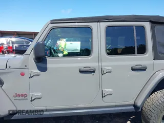 2018 Jeep Wrangler Unlimited Rubicon with VIN 1C4HJXFG6JW267087, listed as a IAAI auction lot 42235058 with 93,962 mi miles and . Bid and sale history available at DreamBid. Image 13.