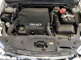 2015 Ford Taurus SHO z VIN 1FAHP2KT1FG157026, wystawiony jako Copart lot #52846065 z przebiegiem 125 107 mil mil oraz Szkoda całkowita • Salvage title. Historia ofert i sprzedaży dostępna na DreamBid. Obrazek 11.