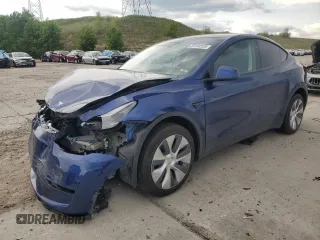 2023 Tesla Model Y Long Range z VIN 7SAYGDEE1PA174035, wystawiony jako Copart lot #59104525 z przebiegiem 24 334 mil mil oraz Szkoda całkowita • Salvage title. Historia ofert i sprzedaży dostępna na DreamBid. Obrazek 1.