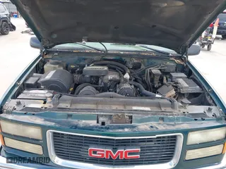 1998 GMC Suburban with VIN 1GKGK26J4WJ734958, listed as a IAAI auction lot 41878070 with 131,528 mi miles. Bid and sale history available at carsss.com. Image 10.