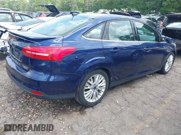 2016 Ford Focus Titanium z VIN 1FADP3J20GL208439, wystawiony jako IAAI lot #42145938 z przebiegiem 135 522 mil mil oraz . Historia ofert i sprzedaży dostępna na DreamBid. Obrazek 4.