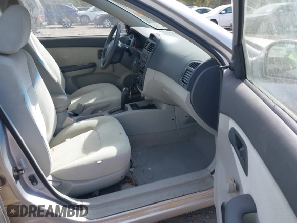2005 Kia Spectra LX with VIN KNAFE121355203561, listed as a IAAI auction lot 41894533 with 32,889 mi miles. Bid and sale history available at carsss.com. Image 5.