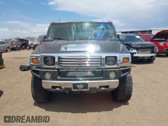 2003 Hummer H2 with VIN 5GRGN23U73H122756, listed as a IAAI auction lot 42194176 with 239,411 mi miles. Bid and sale history available at carsss.com. Image 6.