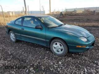 1997 Pontiac Sunfire SE z VIN 1G2JB12T9V7579374, wystawiony jako Copart lot #41468144 z przebiegiem 153 533 mil mil oraz Tytuł czysty. Historia ofert i sprzedaży dostępna na DreamBid. Obrazek 4.