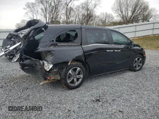 2019 Honda Odyssey Touring with VIN 5FNRL6H8XKB019879, listed as a Copart auction lot 48260545 with 164,233 mi miles and Salvage Title. Bid and sale history available at carsss.com. Image 3.