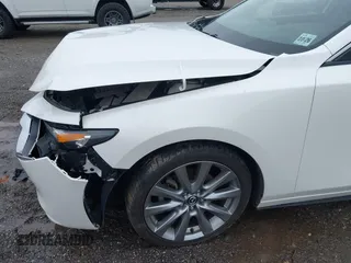 2021 Mazda 3 Preferred z VIN 3MZBPBCL0MM250862, wystawiony jako IAAI lot #42318612 z przebiegiem 86 056 mil mil oraz . Historia ofert i sprzedaży dostępna na DreamBid. Obrazek 17.