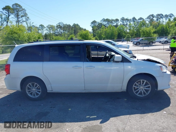 2018 Dodge Grand Caravan SXT with VIN 2C4RDGCG1JR326457, listed as a IAAI auction lot 42047301 with 84,518 mi miles and . Bid and sale history available at DreamBid. Image 13.