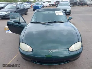 1999 Mazda MX-5 Miata with VIN JM1NB3532X0103631, listed as a IAAI auction lot 42063882 with 119,992 mi miles. Bid and sale history available at carsss.com. Image 6.