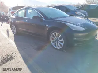2019 Tesla Model 3 Long Range with VIN 5YJ3E1EBXKF392147, listed as a IAAI auction lot 41745460 with 133,745 mi miles. Bid and sale history available at carsss.com. Image 1.