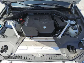 2024 BMW X4 xDrive30i z VIN 5UX33DT09R9W70709, wystawiony jako Copart lot #56997035 z przebiegiem 21 308 mil mil oraz Tytuł czysty. Historia ofert i sprzedaży dostępna na DreamBid. Obrazek 11.