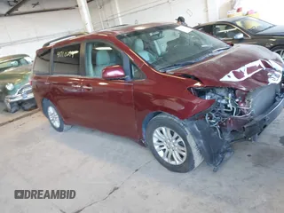 2015 Toyota Sienna XLE with VIN 5TDYK3DC1FS636211, listed as a IAAI auction lot 41710294 with 115,173 mi miles. Bid and sale history available at carsss.com. Image 1.