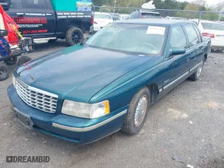1999 Cadillac DeVille DHS with VIN 1G6KE54Y9XU766791, listed as a IAAI auction lot 42005553 with 140,515 mi miles. Bid and sale history available at carsss.com. Image 2.