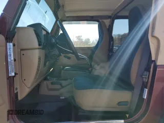 2002 Jeep Wrangler Sahara with VIN 1J4FA59S22P704603, listed as a Copart auction lot 77554334 with 99,758 mi miles and Salvage Title. Bid and sale history available at carsss.com. Image 7.