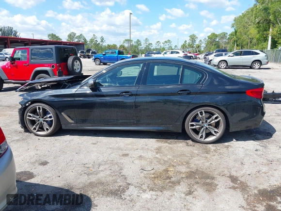 2019 BMW 5 Series M550i xDrive with VIN WBAJB9C51KB289355, listed as a IAAI auction lot 41867984 with 30,106 mi miles and . Bid and sale history available at DreamBid. Image 14.